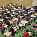 File photo dated 25/05/10 of students sitting an exam, as the Higher pass rate is down from last year but remains above 2019 levels, as more than 140,000 pupils across Scotland receive their exam results.