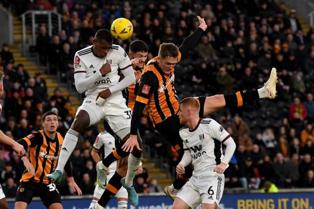 Hull City player Sean McLoughlin is challenged by Fulham's Issa Diop. Picture: Simon Hulme.