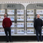 People looking at house price signs displayed in the window of an estate agents in Lewes, East Sussex, as the Office for National Statistics (ONS) has said that the average UK house price has surged by £24,000 during the past year of coronavirus lockdowns. Issue date: Wednesday May 19, 2021.