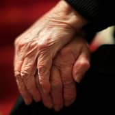 The hands of an elderly woman in Poole, Dorset. 