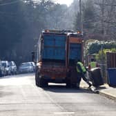 Council workers empty bins in Sunningdale, Berkshire .