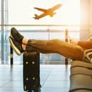 Passenger waits in the departure lounge of an airport