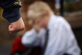 PA file photo dated 18.11 2006 showing a posed image simulating a child being bullied.