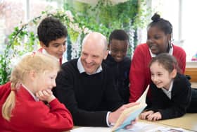 Headteacher Chris Hollands with pupils.