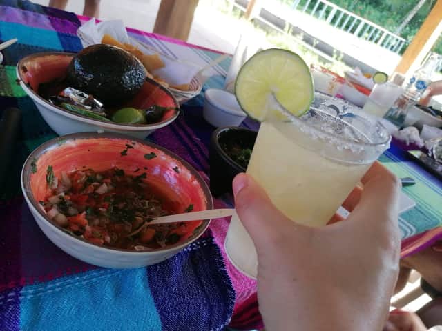 Enjoying margaritas while making salsa during a 'Dance & Salsa' class in Cozumel, Mexico.