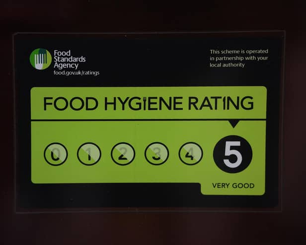 A Food Standards Agency rating sticker on a window of a restaurant in central London. A huge variation in food hygiene standards remains across the UK, with one in five high or medium-risk food outlets failing to meet standards, according to a study.