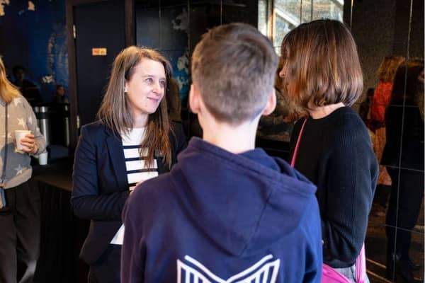 MVA headteacher Suzanne Lindley talking to a family at the London event