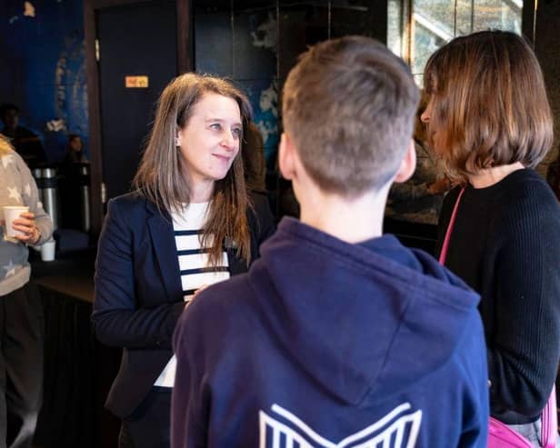 MVA headteacher Suzanne Lindley talking to a family at the London event