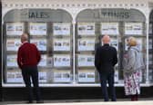 People looking at house price signs displayed in the window of an estate agents in Lewes, East Sussex, as the Office for National Statistics (ONS) has said that the average UK house price has surged by £24,000 during the past year of coronavirus lockdowns. Issue date: Wednesday May 19, 2021.