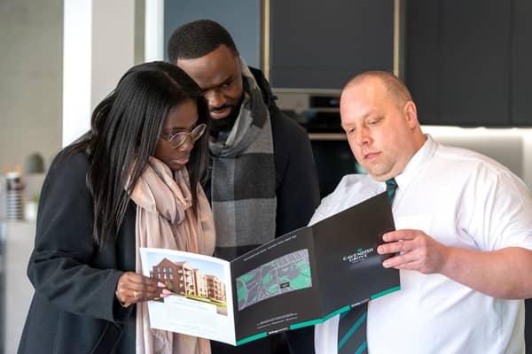 Kwadjo McMartey and Nana Esi Duker are shown details of homes at Cavendish Grove by Bellway sales advisor Luke Charman