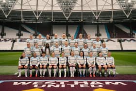 West Ham United Women pose for a squad photo in the Hammers Christmas Jumper.
