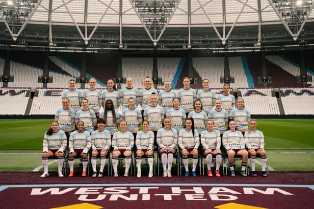 West Ham United Women pose for a squad photo in the Hammers Christmas Jumper.