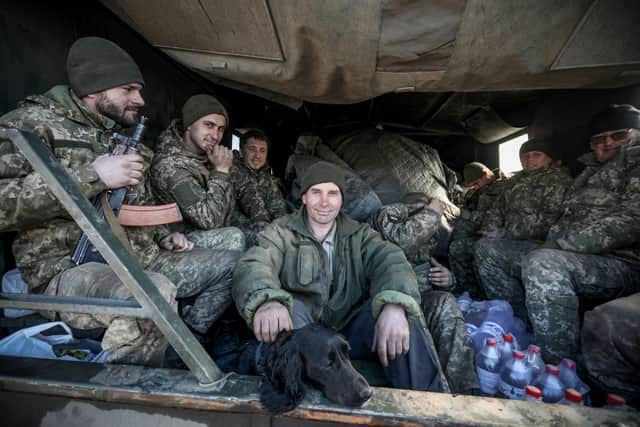 Ukrainian service personnel sit in the back of military truck in the town of Avdiivka, on the front-line with Russia-backed separatists (Picture: Aleksey Filippov/AFP via Getty Images)