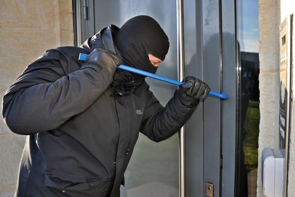 Burglar targeting a home