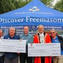 Alfie Buckland holding the Hillingdon Stroke Support Group next to Warren Gell, The Mayor, Keith Gregory and Lou Apcevski.