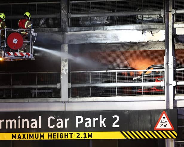 Firefighters battle the fire at Luton Airport which caused a partial collapse of a parking structure in Luton on October 11, 2023. . Photo by HENRY NICHOLLS/AFP via Getty Images