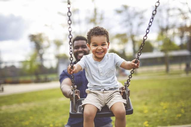 Kid Playing on Swings