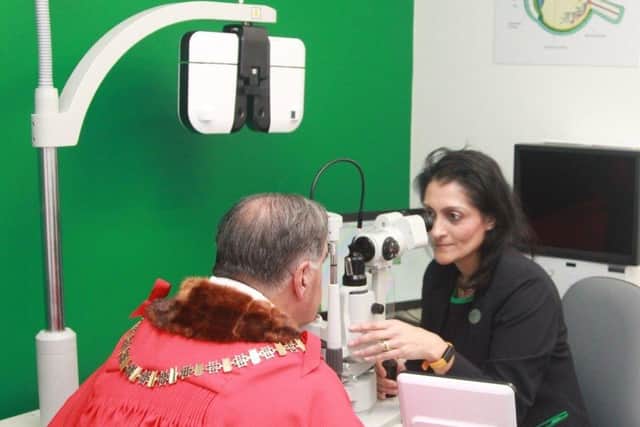 The Mayor of Barnet sight test at Specsavers Edgware Town with Optometrist Director, Poonam Patel.