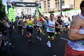 Runners cross the start line in 2024.