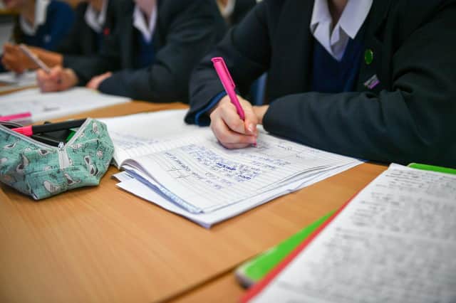 Students write in their exercise books in class at Royal High School Bath, which is a day and boarding school for girls aged 3-18 and also part of The Girls' Day School Trust, the leading network of independent girls' schools in the UK.