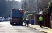 Council workers empty bins in Sunningdale, Berkshire .