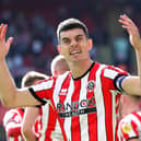 SHEFFIELD, ENGLAND - AUGUST 20: John Egan of Sheffield United celebrates the third goal scored by teammate Iliman Ndiaye (Not pictured) during the Sky Bet Championship between Sheffield United and Blackburn Rovers at Bramall Lane on August 20, 2022 in Sheffield, England. (Photo by George Wood/Getty Images)