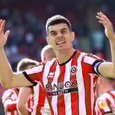 SHEFFIELD, ENGLAND - AUGUST 20: John Egan of Sheffield United celebrates the third goal scored by teammate Iliman Ndiaye (Not pictured) during the Sky Bet Championship between Sheffield United and Blackburn Rovers at Bramall Lane on August 20, 2022 in Sheffield, England. (Photo by George Wood/Getty Images)