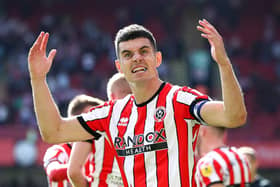 SHEFFIELD, ENGLAND - AUGUST 20: John Egan of Sheffield United celebrates the third goal scored by teammate Iliman Ndiaye (Not pictured) during the Sky Bet Championship between Sheffield United and Blackburn Rovers at Bramall Lane on August 20, 2022 in Sheffield, England. (Photo by George Wood/Getty Images)