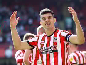 SHEFFIELD, ENGLAND - AUGUST 20: John Egan of Sheffield United celebrates the third goal scored by teammate Iliman Ndiaye (Not pictured) during the Sky Bet Championship between Sheffield United and Blackburn Rovers at Bramall Lane on August 20, 2022 in Sheffield, England. (Photo by George Wood/Getty Images)