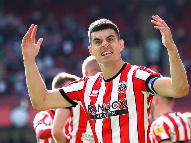 SHEFFIELD, ENGLAND - AUGUST 20: John Egan of Sheffield United celebrates the third goal scored by teammate Iliman Ndiaye (Not pictured) during the Sky Bet Championship between Sheffield United and Blackburn Rovers at Bramall Lane on August 20, 2022 in Sheffield, England. (Photo by George Wood/Getty Images)