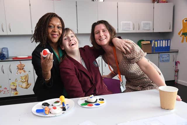 From L to R Susan, Egle, and Miss O’Connor all smiles with painted rocks donated by Bellway.
