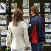 File photo dated 02/09/08 of a couple standing outside an estate agent's window. The number of people taking their first step on to the property ladder with a mortgage last year is estimated to have topped 400,000 for the first time since 2006. Issue date: Tuesday January 4, 2022.