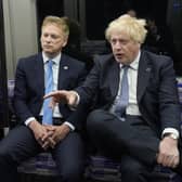 (Right to left) Prime Minister Boris Johnson with Transport Secretary Grant Shapps and Mayor of London Sadiq Khan on a Elizabeth Line train at Paddington station in London, to mark the completion of London's Crossrail project.