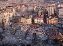 An aerial photo shows collapsed buildings in Antakya on February 11, 2023, after a 7.8-magnitude earthquake struck the country's southeast  (Photo by Hassan AYADI / AFP) (Photo by HASSAN AYADI/AFP via Getty Images)