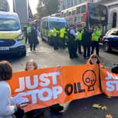 Members of Just Stop Oil block off the road in Whitehall.