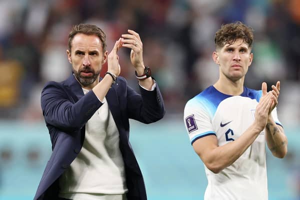 DOHA, QATAR - NOVEMBER 21: Gareth Southgate and John Stones of England applauds the fans after their sides victory during the FIFA World Cup Qatar 2022 Group B match between England and IR Iran at Khalifa International Stadium on November 21, 2022 in Doha, Qatar. (Photo by Richard Heathcote/Getty Images)