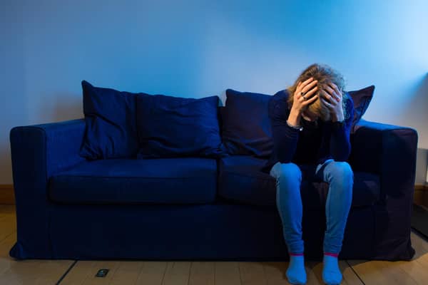 PICTURE POSED BY MODEL A woman showing signs of depression.