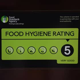 A Food Standards Agency rating sticker on a window of a restaurant in central London. A huge variation in food hygiene standards remains across the UK, with one in five high or medium-risk food outlets failing to meet standards, according to a study.