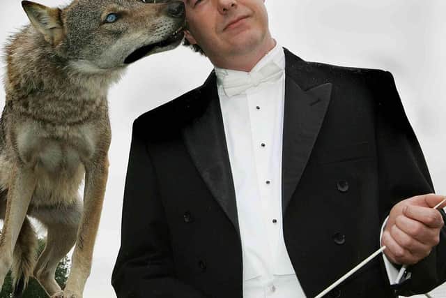 Conductor Mark Stephenson and the wolf.