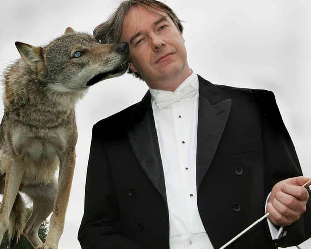Conductor Mark Stephenson and the wolf.
